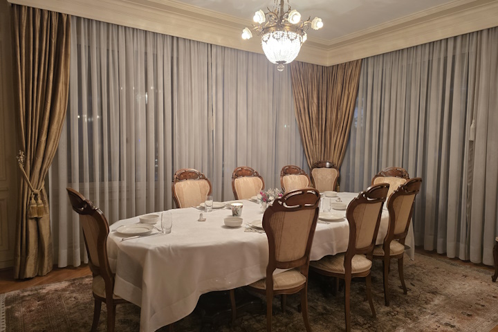 Formal dining area of the villa at night